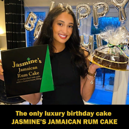 Woman holding her birthday cake Jasmine's Jamaican Rum Cake at her birthday party 